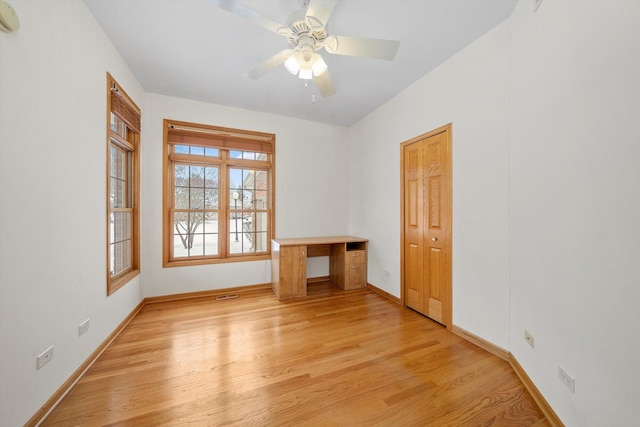 spare room featuring ceiling fan and light wood-type flooring