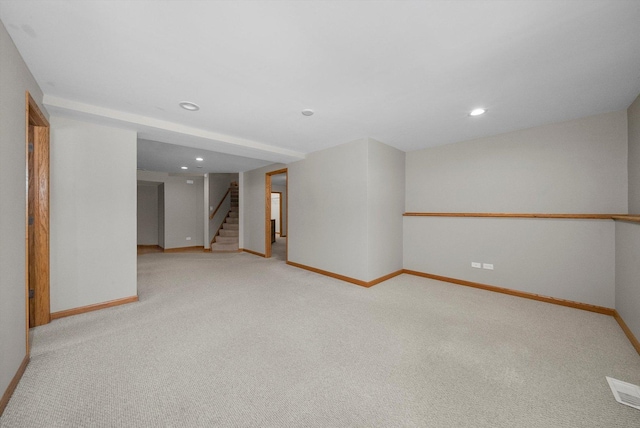 spare room with light colored carpet