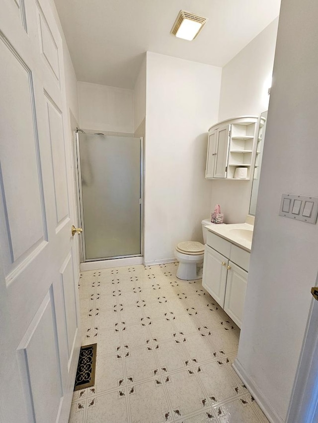 bathroom with toilet, walk in shower, and vanity