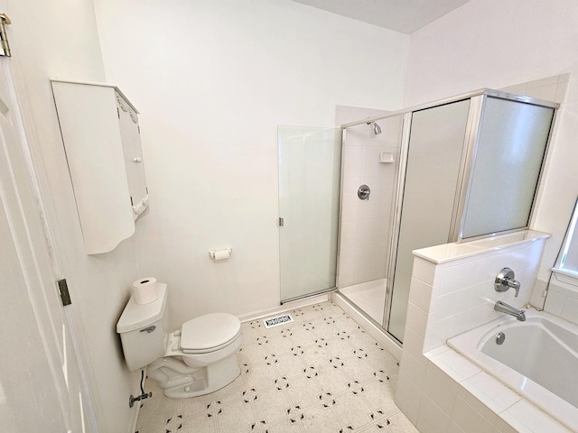 bathroom with toilet and shower with separate bathtub