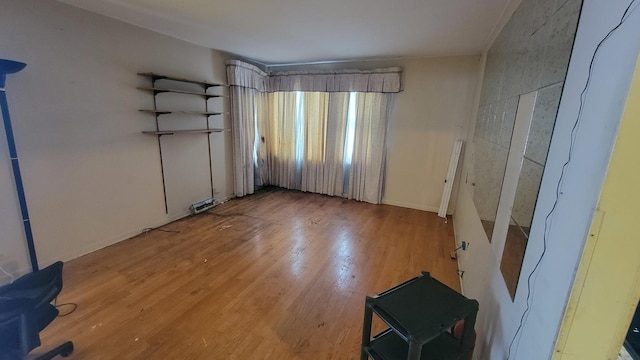 unfurnished room with light hardwood / wood-style flooring