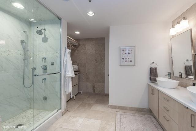 bathroom with an enclosed shower and vanity