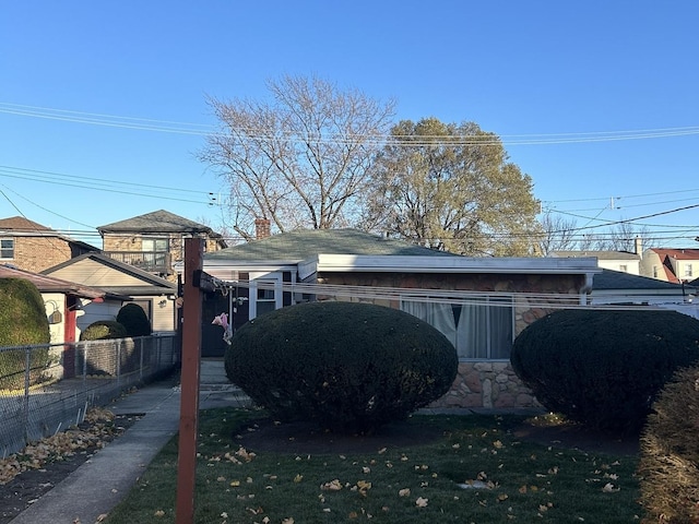 view of side of home featuring a lawn