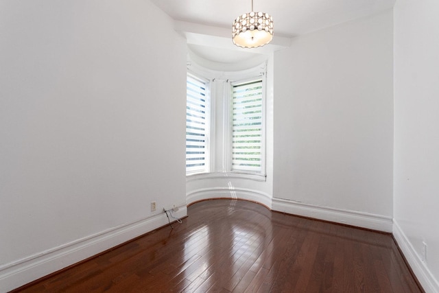 empty room with hardwood / wood-style floors