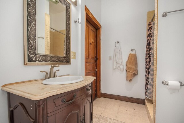 bathroom featuring tile patterned floors, vanity, and a shower with shower curtain