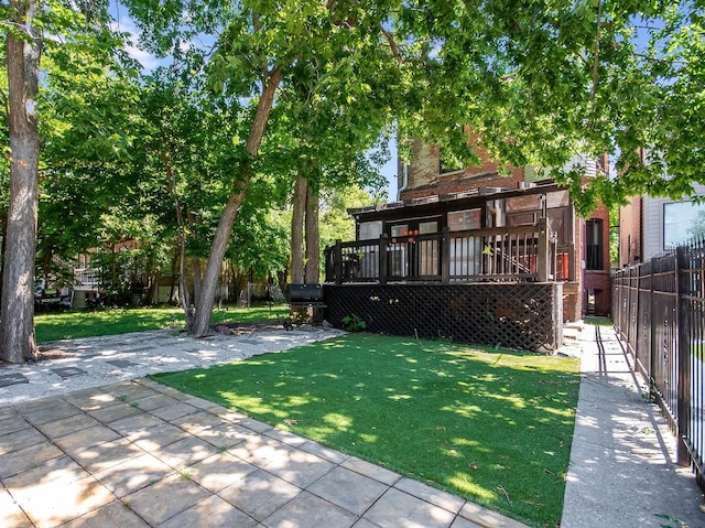 view of yard with a wooden deck