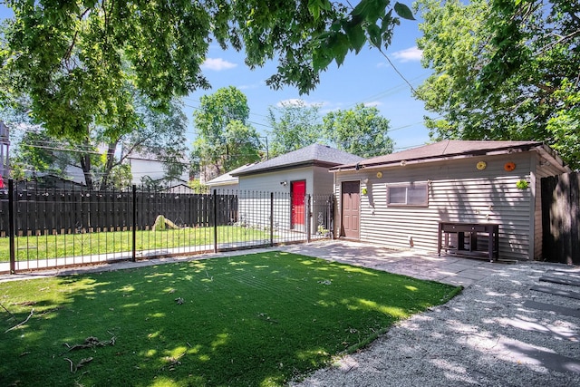 back of property with a lawn and a patio area