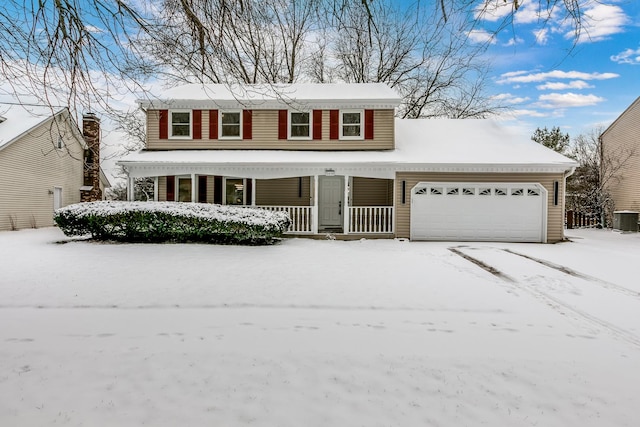 front of property with a garage and cooling unit