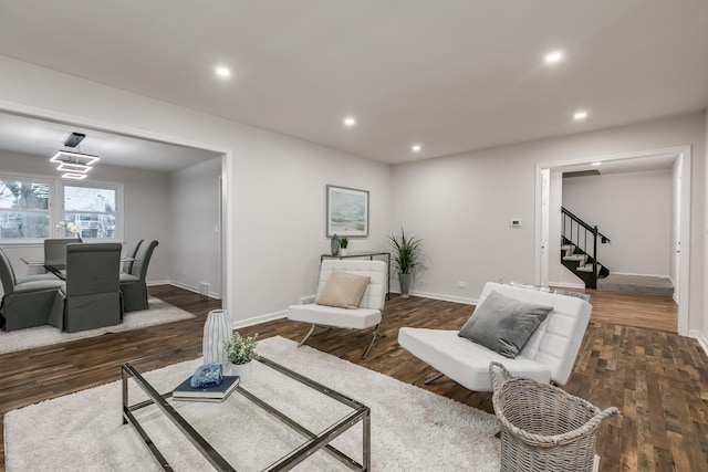 living room featuring dark wood-type flooring