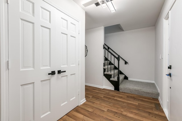 foyer entrance featuring hardwood / wood-style floors