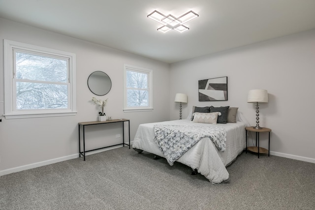 bedroom featuring carpet floors and multiple windows