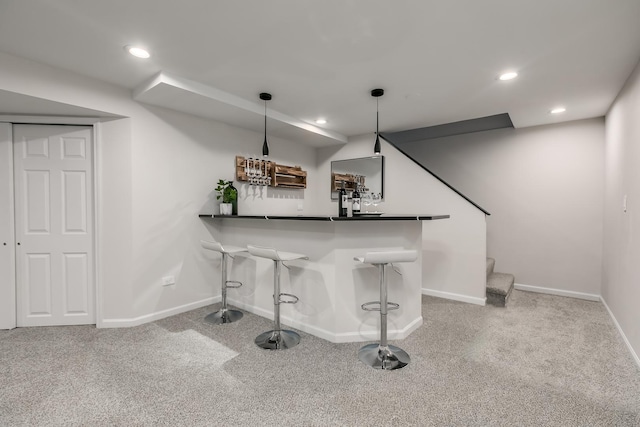 bar featuring carpet and pendant lighting