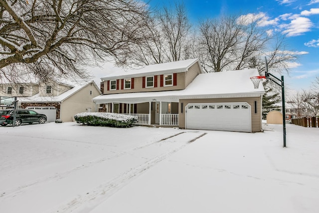 view of front of property featuring covered porch and a garage