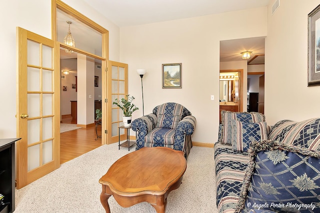 living room with carpet flooring and french doors