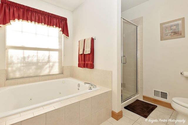 bathroom featuring shower with separate bathtub, toilet, and tile patterned floors