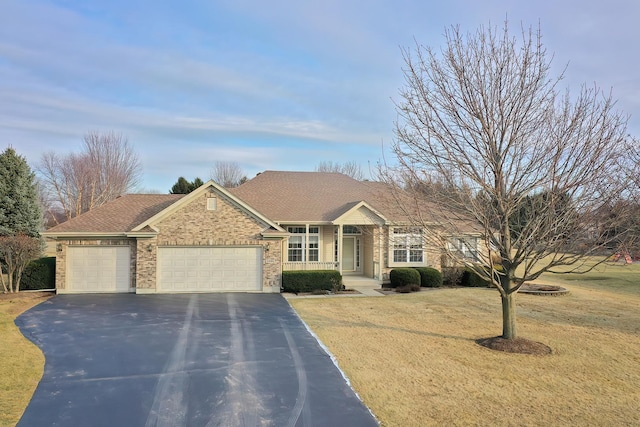 ranch-style home with a garage and a front lawn