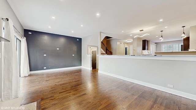 unfurnished living room featuring dark wood-type flooring