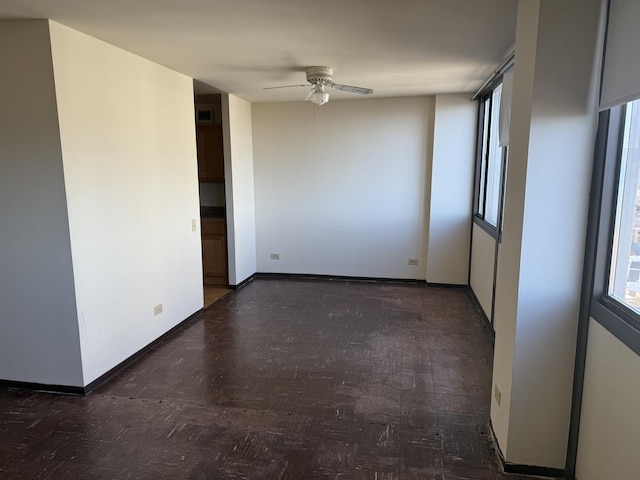 empty room featuring ceiling fan