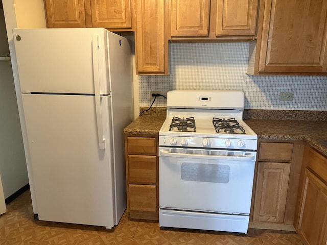 kitchen with white appliances and decorative backsplash