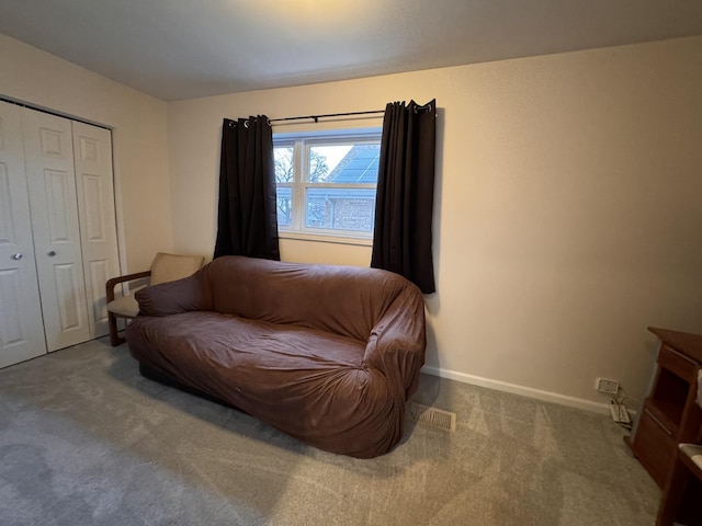 living area featuring carpet flooring