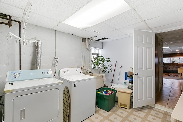 laundry room featuring sink and washing machine and clothes dryer