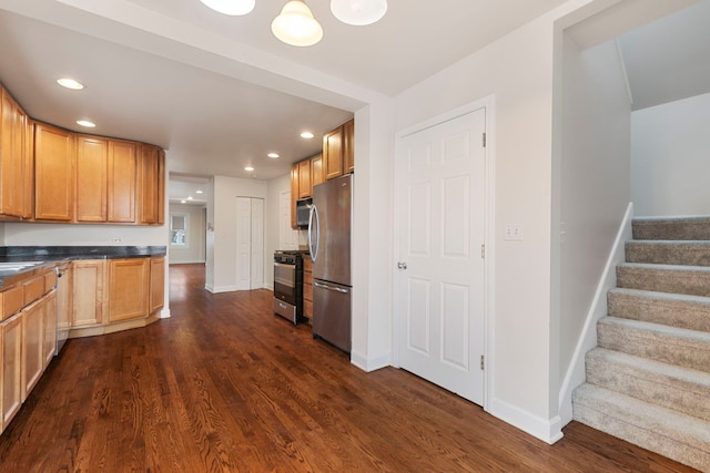 kitchen with sink, dark hardwood / wood-style flooring, and stainless steel appliances