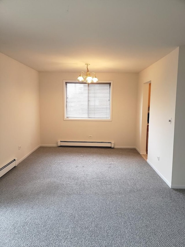 empty room with carpet, a notable chandelier, and a baseboard heating unit