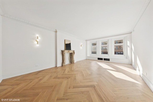 unfurnished living room featuring crown molding and light parquet flooring