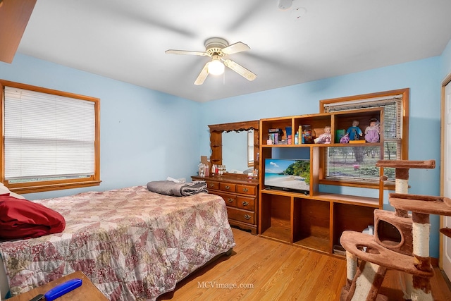 bedroom featuring light hardwood / wood-style floors and ceiling fan