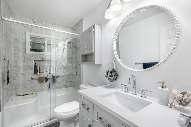 bathroom with vanity, toilet, and walk in shower