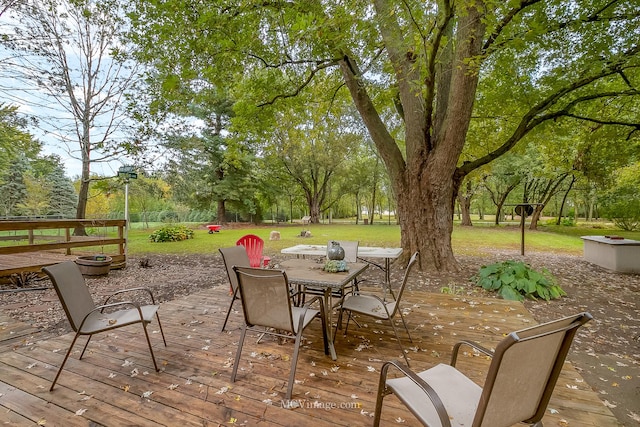 wooden deck featuring a yard