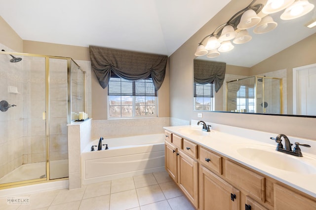 full bathroom with tile patterned floors, a garden tub, a stall shower, and a sink