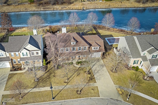 bird's eye view with a residential view and a water view