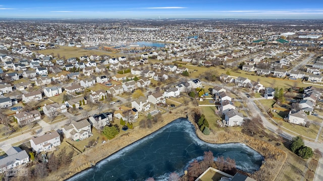 aerial view with a residential view and a water view