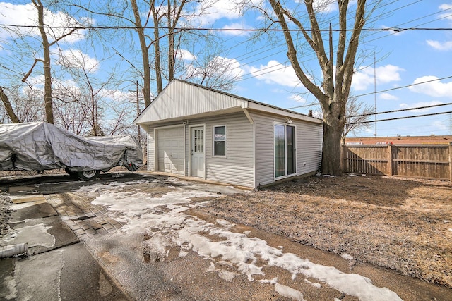 exterior space with driveway and fence