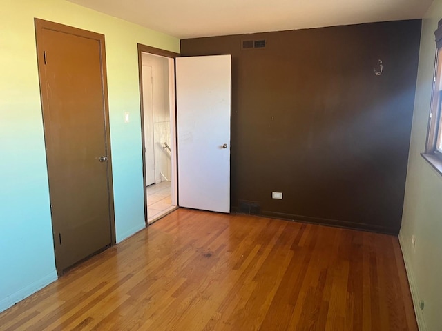 unfurnished bedroom featuring light hardwood / wood-style floors