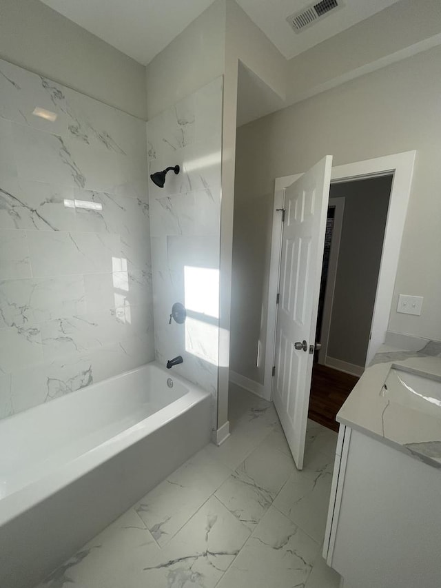 bathroom featuring vanity and shower / bath combination