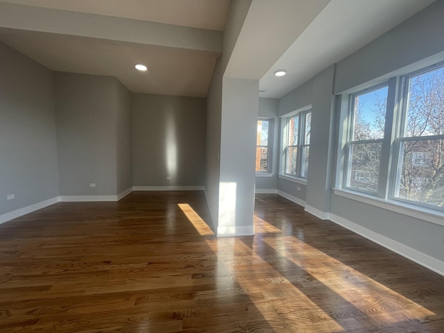 empty room featuring dark wood-type flooring