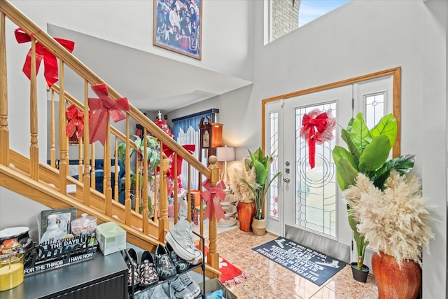 foyer entrance with a high ceiling