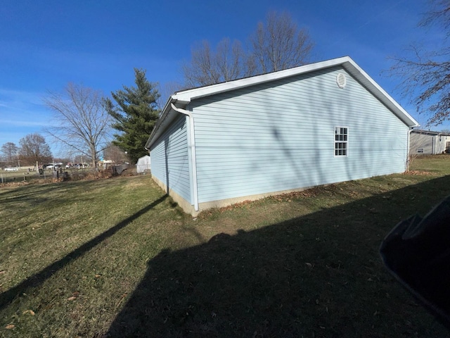 view of property exterior featuring a lawn