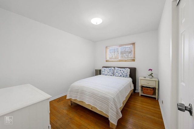 bedroom featuring dark wood-type flooring