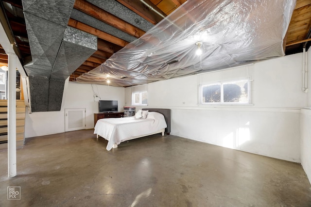 unfurnished bedroom featuring concrete floors