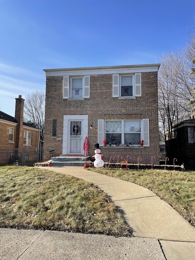 view of front of property with a front lawn