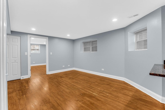 basement with wood-type flooring