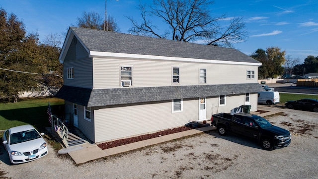 view of side of property featuring cooling unit