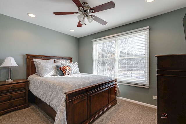 bedroom with light colored carpet and ceiling fan