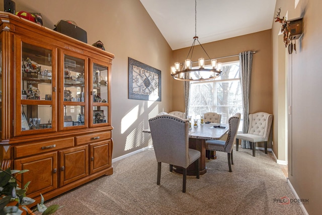 dining room featuring a chandelier, light carpet, and vaulted ceiling