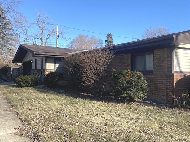 view of home's exterior with a yard