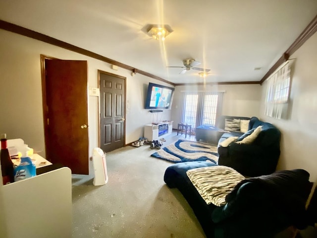 living room with ceiling fan and ornamental molding