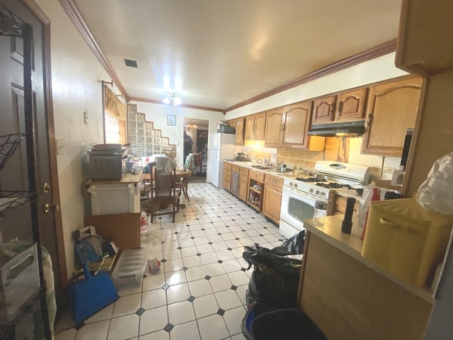 kitchen featuring white appliances and crown molding